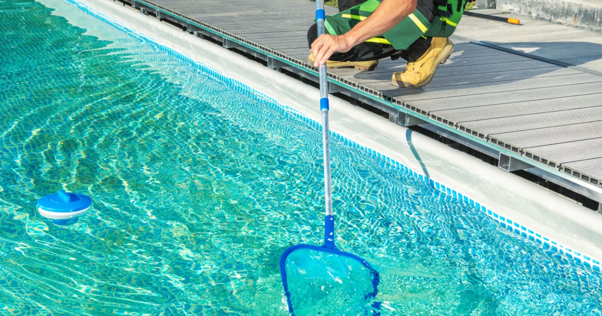 Cleaning Swimming Pool with Skimmer Net