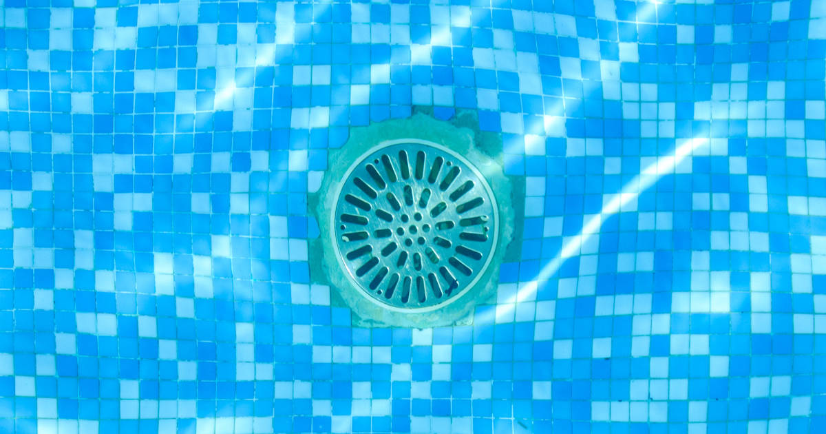 Pool drain Drain of a pool, seen through the water from above.